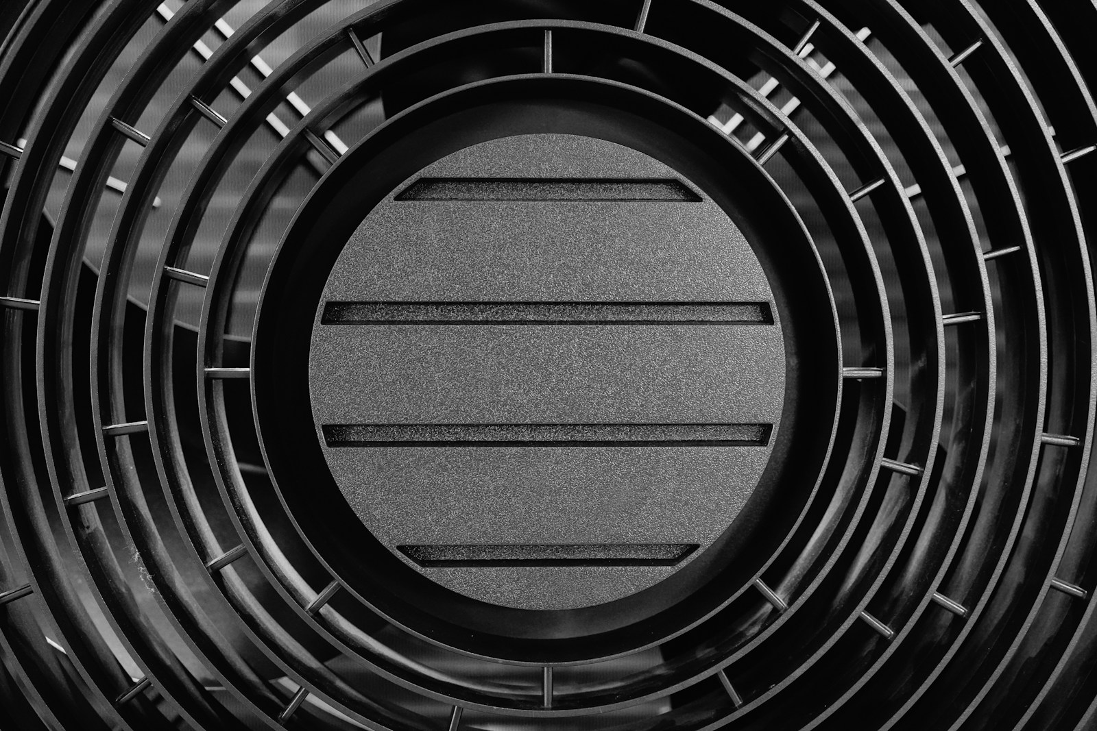 Close-up of an outdoor heat pump fan
